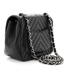 This is an authentic CHANEL Lambskin Chevron Quilted Mini Square Flap in Black. The chic crossbody bag is crafted of soft lambskin leather in black with chevron quilting. The bag features a black leather threaded gold chain-link shoulder strap and a gold Chanel CC turn-lock securing the front flap. This opens to a black leather interior with zipper and patch pockets. Chic Crossbody Bag, Gold Chanel, Chevron Quilt, Leather Thread, The Chic, Leather Interior, Lambskin Leather, Chain Link, Gold Chain