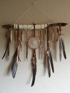 a group of feathers hanging from the side of a wall