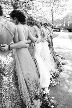 a group of women standing next to each other