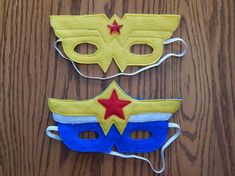 two masks made to look like superheros