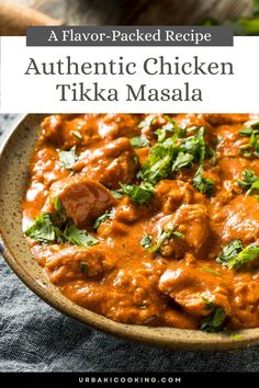 a bowl filled with chicken tikka masala and garnished with cilantro