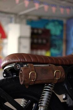 a brown leather seat on the back of a motorcycle