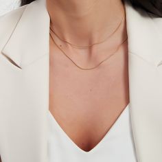 Double gold snake chain necklace. This necklace is a two layers set. The set has one short and one long snake chain. It is your go to every-day necklace. A perfect addition to your jewelry collection! ………………………………….D E T A I L S• Materials: Stainless steel, 18k gold plating.• Length: long chain: 15 inches (38 cm), short chain: 14 inches (35 cm) + extension 2 inches (5 cm)• This product is hypoallergenic, water and tarnish resistant Double Snake Chain Necklace, Trendy Gold Snake Chain Necklace With Delicate Chain, Dainty Snake Chain Necklace For Layering, Gold Dainty Snake Chain Necklace, Minimalist Layered Necklace With Clavicle Chain, Minimalist Snake Chain Layered Necklace, Double Chain Snake Necklace For Layering, Snake Chain Necklace With Double Chain For Layering, Gold Snake Chain Layered Necklace Gift