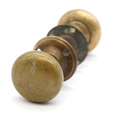 an old brass door knob on a white background