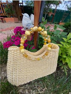 Vintage, yes, some time in the 2000's but NOT an original 1950's straw purse. (There IS ONE left on the site). Vinyl braided straw, beige, the inside is fully lined and with little pockets, AND a top zipper. The handles are the "look" of the purse. Carved and polished plastic beads strung on a metal ring and sewn into the top of the bag. Very nice item. Well made and sturdy. Height 8" Length 12" Bottom 3.5" Straw Purse, Bead Stringing, Metal Ring, Plastic Beads, Hand Bag, Metal Rings, Purses And Handbags, Straw, I Am Awesome