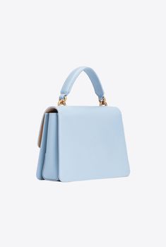 Mini Love Bag One Top Handle Light in soft, silky leather with a light, deconstructed design. The fastening is embellished with the iconic metal Love Birds Diamond Cut buckle. The accessory boasts a microsuede-lined interior and a zipped slip pocket. Adjustable and removable leather shoulder strap, and top handle. Elegant Light Blue Bag For Daily Use, Elegant Light Blue Top Handle Bag, Designer Light Blue Shoulder Bag With Detachable Strap, Timeless Blue Shoulder Bag For Evening, Elegant Light Blue Crossbody Bag, Chic Light Blue Formal Bag, Designer Light Blue Bag With Detachable Strap, Designer Light Blue Bags With Detachable Strap, Designer Light Blue Top Handle Shoulder Bag