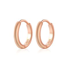 Our Simple Huggie Hoops are the perfect addition to your jewelry collection. The staple that you'll never want to take off, and never have to. Use these as a base to your curated ear stack or wear alone for a modern, minimalist allure. DETAILS & SIZE Sold as a pair Composition: 14k gold, rose gold or white gold plated over sterling silver Measurements: your choice of 5mm, 6mm, 7mm, 8mm or 9mm Hinged hoops with a secure snap post closure Read about how to care for your jewelry here. Shop the Piercing Oreille Tragus, Silver Nose Hoop, Hoop Nose Ring, Ear Piercings Tragus, Cartilage Jewelry, Celtic Knots, Ear Stack, Nose Rings Hoop, Nose Hoop