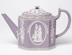 a purple and white teapot with an image of a man and woman on it