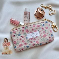 This cute handmade quilted keychain wallet is a must-have addition to your fashion accessory collection for keeping your essentials like business cards, cash, change, receipts, keys, lipstick, earrings, jewelry, small toiletries or cosmetic items. Made of high-quality cotton fabric with a durable YKK zipper, it also doubles as coin purse, small makeup bag or card holder. Each pouch comes with a detachable keychain which makes it easy to carry and attach to your keys or handbag for easy access and better organization. It's perfect for everyday use or as a unique gift. Material: Cotton (exterior and lining) with batting (exterior) & YKK golden brass metal zipper Size: Pouch: 13 x 7 cm / 5.1" x 2.8" Keychain: 7 cm / 2.8" Care tips: Spot clean with white damp towel and use mild detergent if ne Cute Everyday Coin Purse, Coin Purse With Key Clip For Gift, Cute Everyday Coin Purse With Zipper, Trendy Compact Coin Purse Gift, Trendy Compact Coin Purse As Gift, Quilted Keychain, Lipstick Earrings, Cute Card Holder, Tiny Makeup