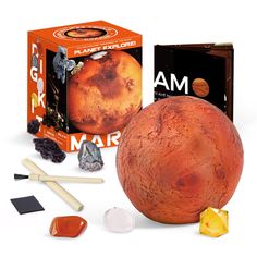 an orange object is next to some other items that look like it's made out of clay