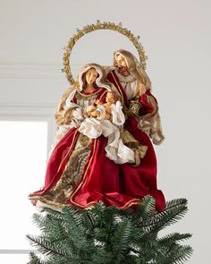 a christmas ornament with an image of the virgin mary and child jesus