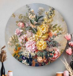 a painting on the wall with flowers in it