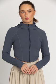 The perfect throw-on-and-go jacket is our Storm Athletic Hoodie Jacket. This piece features a classic hoodie style with thumb-hole finished sleeves. The material is a soft, stretch fabric that controls temperature and provides a cool, sporty look. 4-way Stretch Long Sleeve Activewear For Sports, Half-zip Athleisure Hoodie For Workout, Athleisure Half-zip Hoodie For Workout, Athleisure Half-zip Workout Hoodie, Fitted Long Sleeve Windbreaker, Functional Sports Sweatshirt With Long Sleeves, Functional Long Sleeve Track Jacket For Winter, Athleisure Half-zip Hoodie For Gym, Athleisure Activewear With Drawstring Hood And Half-zip