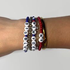 "These New York Giants themed beaded bracelets come in multiple color options and can say a variety of things such as New York, NY, Giants, Big Blue, OR select \"Other\" and specify in the personaliztion.  Please select size and style options in the personalization box. This bracelet is stretchy and made for the average-sized adult, if you need it to be larger or smaller please specify the size in inches in the notes section when purchasing.  IF you would like this style bracelet to say something else, check out our other listing below. https://www.etsy.com/listing/773122283/customized-name-bracelet?ref=shop_home_active_4  Feel free to reach out with any other questions or concerns! **Not recommended for children under 4 years old **" Novelty Personalized Blue Bracelets, Blue Novelty Personalized Bracelets, Personalized Blue Novelty Bracelet, Novelty Personalized Blue Bracelet, Blue Adjustable Novelty Bracelet, Blue Adjustable Novelty Bracelets, Casual Nickel Free Round Bead Bracelets, Team Spirit Crafts, Sports Bracelet