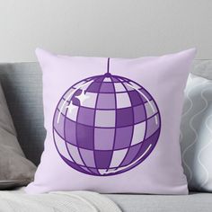 a purple and white plaidered globe on a pink background with an arrow in the center