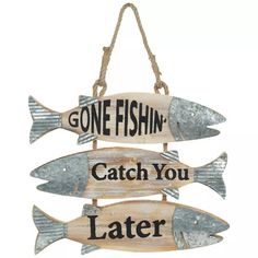 a sign that says, gone fishing catch you later and three fish hanging from it