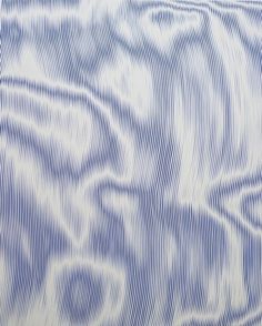 an abstract blue and white background with wavy lines