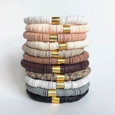 The colors that go with everything!  Mix-and-match these trendy lightweight bracelets to build the perfect stack. A few of these make the perfect gift that's she's going to love! Made with 8mm Heishi beads and brushed gold OR silver accent beads. ⭐️Each bracelet is sold INDIVIDUALLY! ⭐️ Bracelets are handmade on strong stretch cord and approximately 7 inches in length, which fits small to medium adult wrists. Custom sizing is available! If you have concerns about sizing, please message me so we Heishi Bracelets, Heishi Bracelet, Initial Charm Bracelet, Homemade Bracelets, Autumn Bracelet, Polymer Clay Bracelet, Disc Bracelet, Bracelets Design, Clay Bracelet