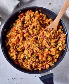 a skillet filled with rice and beans