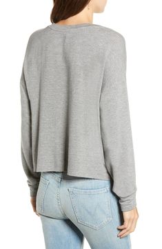 A versatile staple, this sporty pullover is made in a luxe blend of supersoft fibers and has a heathered finish that goes with everything. Crewneck Long sleeves 62% rayon, 30% cotton, 5% spandex, 3% polyester Machine wash, tumble dry Imported t.b.d. Versatile Tops With Ribbed Cuffs For Layering, Versatile Cotton Sweatshirt For Loungewear, Comfy Stretch Tops For Layering, Casual Soft-washed Tops For Lounging, Versatile Soft Knit Tops For Loungewear, Soft-washed Tops With Shirttail Hem For Fall, Athleisure Gray Tops With Ribbed Cuffs, Sporty Long Sleeve Top For Loungewear, Gray Athleisure Tops With Ribbed Cuffs