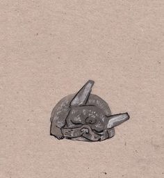 a drawing of a turtle laying down on the ground with its head in the sand