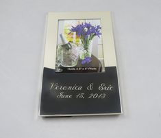 a wedding photo frame with purple flowers in it