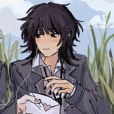 an anime character is sitting in the grass with headphones on and looking at his cell phone