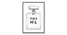 a bottle of table no 4 perfume sitting on top of a white box with a black border around it