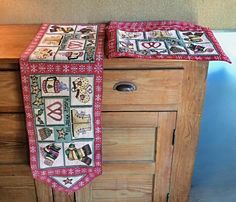 two ties are hanging on the side of a dresser with drawers and drawers in front of it