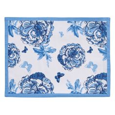 a blue and white placemat with flowers on it