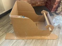 an open cardboard box sitting on the floor