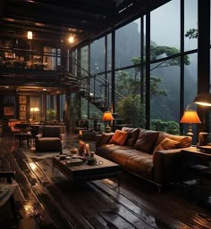 a living room filled with furniture and lots of windows next to a mountain side area