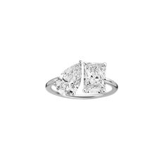 three stone diamond ring in white gold with diamonds on each side and two square stones at the top