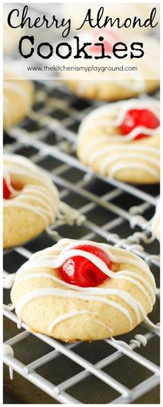 cherry almond cookies with white icing on a cooling rack