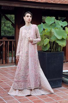 Brand: EZRACollection: Ermina by Ezra Unstitched Luxury Wedding CollectionFabric: Net DESIGN DETAILS: Embroidered Hand Embellished Centre(front) Panel (net) Embroidered Hand Embellished Right (front)panel (net) Embroidered Hand Embellished Left Panel (net) Embroidered Hand Embellished Sleeves (net) Embroidered Daman Boarder (net) Embroidered Back Spray (net) Embroidered Dupatta (net) Attached Dupatta Pallu Dyed Inner (silk) Foil Printed Trouser (raw Silk) DISCLAIMER:* Lining, Laces, and Tassels Pink Dupatta, Wedding Hands, Unstitched Dress Material, Printed Trousers, Extra Fabric, Pakistani Wedding, Fabric Stores Online, Wedding Collection, Designer Suits