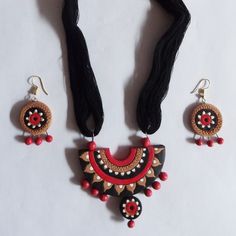 Necklace and earrings set - hand painted clay. discovered while waiting for the ferry back to Mayapur from Nabadwip West Bengal - sold in a little little booth behind the tobacco/candy booth - i understood - she had painted those one-of-a-kinds and  imagined the hut in the jungle that inspired those primitive patterns - i later discovered all the way up to delhi many same style one-of-a-kinds .... but none as pretty and fancifull Artistic Hand Painted Jewelry For Festive Occasions, Handmade Red Clay Jewelry, Red Hand Painted Jewelry For Festivals, Hand Painted Multicolor Clay Jewelry, Bengal Jewellery, Candy Booth, Antique Elephant, Painted Necklace, Jewelry Sets Handmade