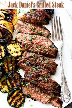 steak and grilled vegetables on a white plate