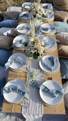 a table set with blue and white plates