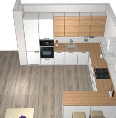 an overhead view of a kitchen with white cabinets and wood flooring