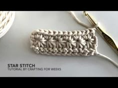 the crochet stitch is being worked on with scissors