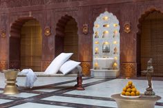 the interior of an ornate building with white and gold decorations on it's walls