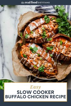 the easy slow cooker buffalo chicken recipe is shown in a bowl on a marble counter top