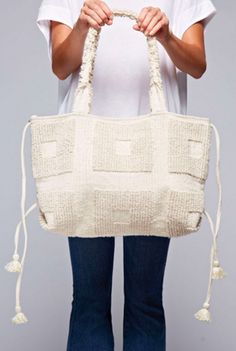 Get 'all squared up' for the weekend with this oversized looped tote in a relaxing natural color. This carpet tote features internal pockets and a fun tassel accent on the sides. The exterior has a geometric square pattern that looks completely embossed in the same color. This is not your Grandma's macrame bag! - Available in Natural - Cotton lining. - 100% polyester. - Imported. - By LoveStitch. Nature Feminine, Natural Carpet, Macrame Bag, Geometric Diamond, Square Pattern, Natural Color, Natural Cotton, Tan Leather, Tote Handbags