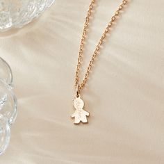 A treasured keepsake, our Children’s Personalized Mini Boy Necklace is a heartfelt reminder of just how loved they are. A gift they’ll treasure as they grow, the Mini Boy Charm can be hand engraved with the name and birth date of your precious little one to create a one-of-a-kind gift for them to adore.&nbsp;18K Champagne Gold Plated, 925 Sterling Silver or 18K Rose Gold PlatedMini Boy: 0.47 x 0.31Secure clasp fasteningCharms are removable from this chain and can be worn on all Merci Maman chain lengthsHand engraved in our Paris workshopSent with love in a complimentary gift boxAny slight variations in lettering depth, spacing and alignment from the examples shown are part of the aesthetic and originality of the piece.Children’s Warning: please note, this piece of jewelry is not a toy. Boy Necklace, Boys Necklace, Mini Charm, Champagne Gold, Hand Engraving, 18k Rose Gold, Rose Gold Plates, Gold Necklace, 925 Sterling Silver