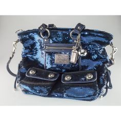 Coach Poppy Blue Sequin Spotlight Purse w/ Disco Ball Bag Charm XL Gorgeous Sequin Poppy Purse by Coach Features a Number of Silver Elements, a Tag Zipper, and a Disco Ball Bag Charm 12" Wide 13" Long 3" Deep Overall purse is in good condition. Some minor wear on leather elements and other minor signs of use on interior. See photos for details. Reference Item #A07122204C JP 12/16/22 Louis Vuitton Key Holder, Coach Bags Outlet, Cheap Coach Bags, Coach Tote Bags, Coach Poppy, Black Leather Tote Bag, Coach Tote, Bags Coach, Coach Shoulder Bag