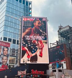 an advertisement on the side of a building in new york city, with images of basketball players