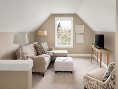 a living room filled with furniture and a flat screen tv