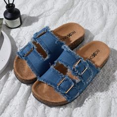 Step into comfort and style with the Roxoni Women's Comfort Flat Sandals. These sandals are designed to provide all-day ease with a chic touch, perfect for any casual outing.

- **Size**: 8
- **Color**: Blue
- **Material**: Suede
- **Gender**: Female
- **Features**: Double buckle adjustable straps, EVA flat-slide footbed, open toe design with straps and fringes

Crafted with a soft suede material that feels gentle against the skin, these sandals feature an adjustable double-buckle design that al Trendy Sandals With Buckle Closure For Beach Season, Trendy Buckle Closure Sandals For Beach Season, Beach Slippers With Buckle Closure And Round Toe, Beach Slippers With Buckle Closure And Flat Heel, Flat Heel Beach Slippers With Buckle Closure, Flat Heel Slippers With Buckle Closure For Beach, Casual Open Toe Sandals With Buckle Closure, Trendy Beach Slip-on Footbed Sandals, Trendy Slip-on Footbed Sandals For Beach