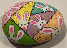 an easter egg decorated with rabbits on it