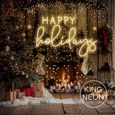 a christmas tree and presents in front of a fireplace with the words happy holidays written on it